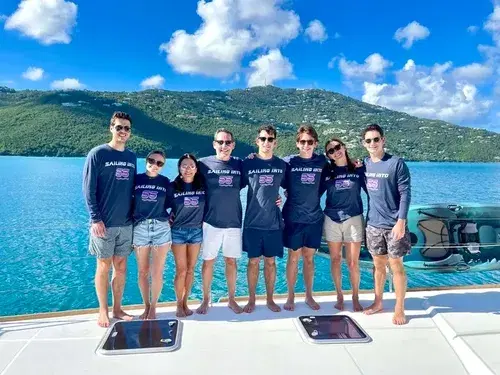 A group wearing their vacation shirts A group wearing their vacation shirts